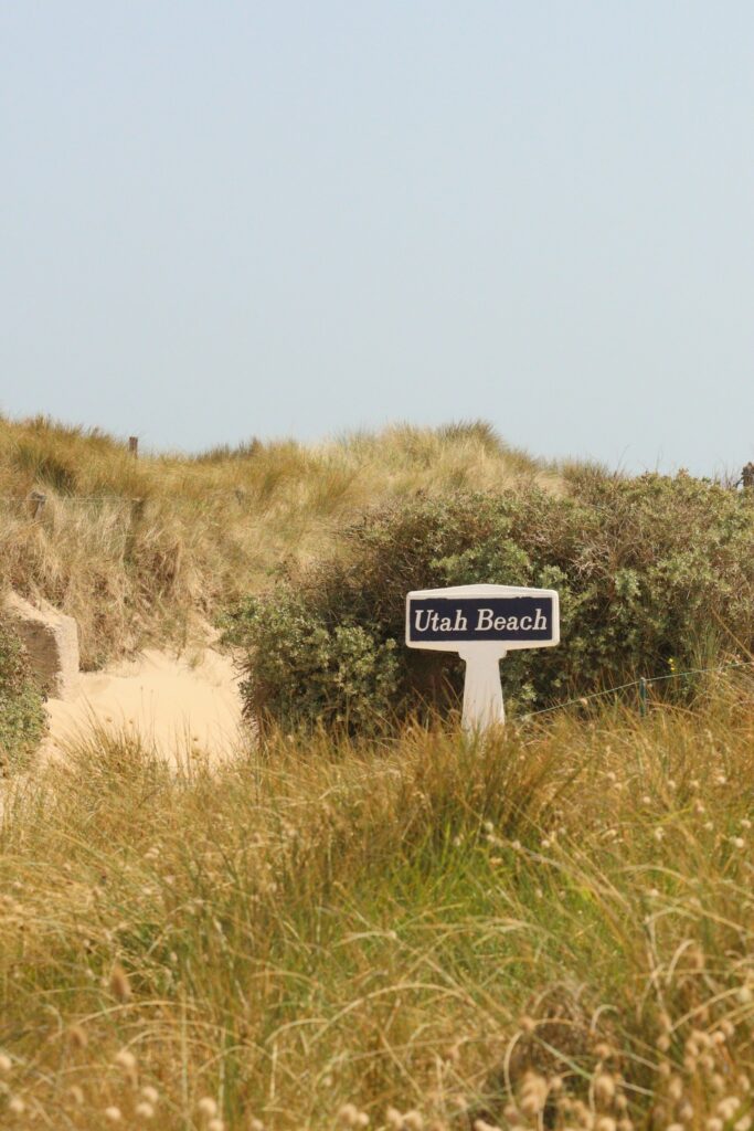 a sign that is in the middle of a field